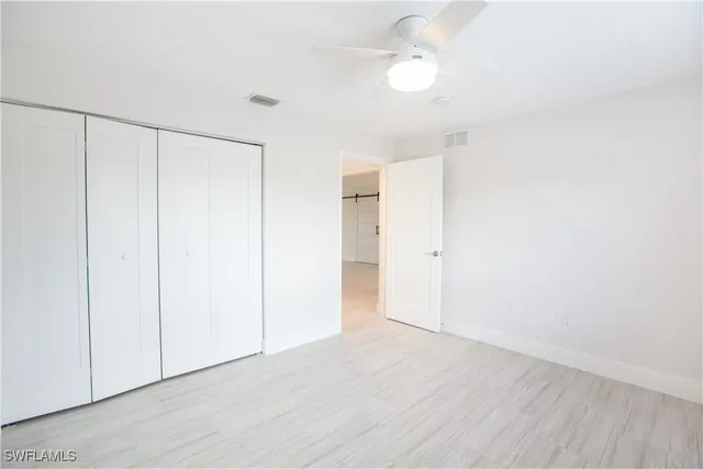 a view of an empty room and window