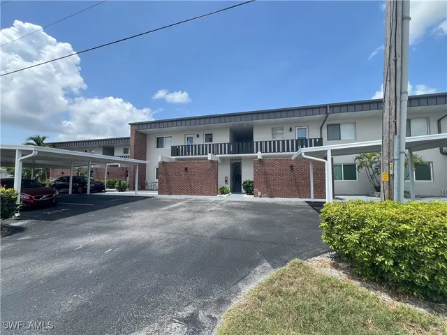 a kitchen with stainless steel appliances granite countertop a refrigerator stove and sink