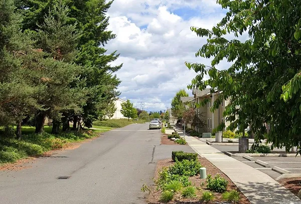 a view of a street with a building