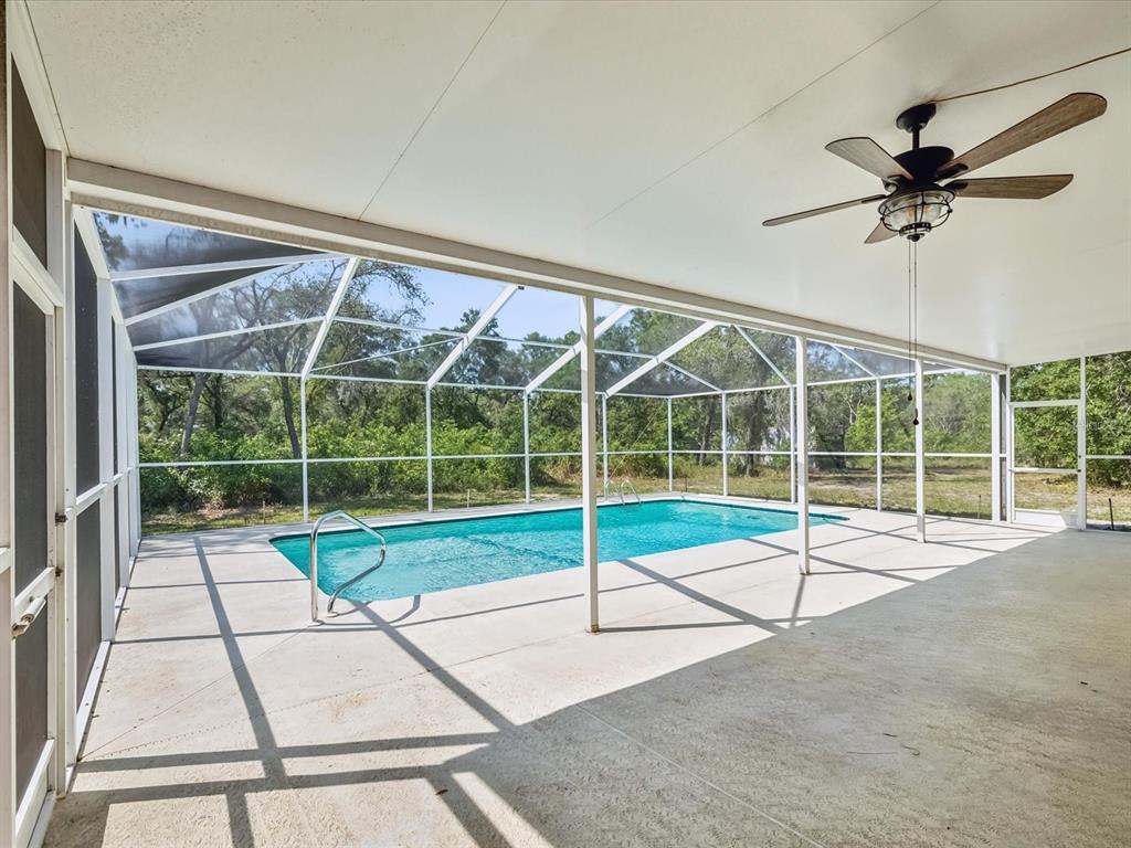 15420 Aubrey Avenue Spring Hill, FL 34610 - Photo 28 of 28 a view of an empty room with a flat screen tv