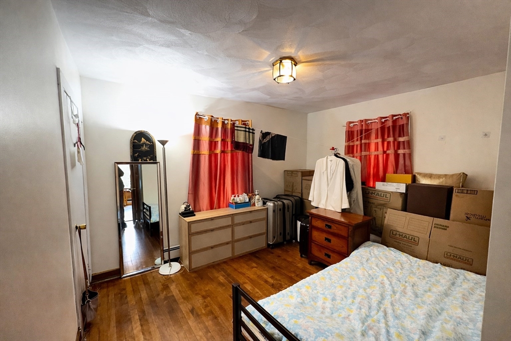 328 Brooks Street Worcester, MA 01606 - Photo 14 of 32 a bed room with a bed and furniture