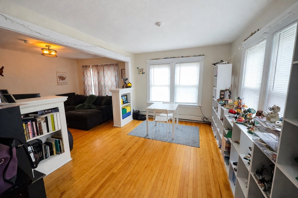 328 Brooks Street Worcester, MA 01606 - Photo 17 of 32 a living room with furniture fireplace and a large window