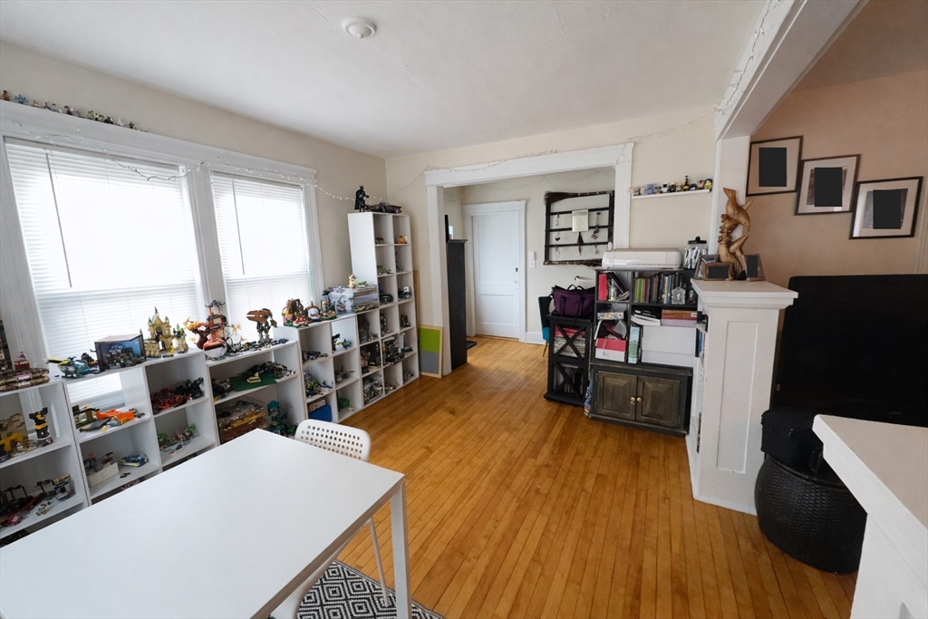 328 Brooks Street Worcester, MA 01606 - Photo 18 of 32 a living room with furniture and a wooden floor