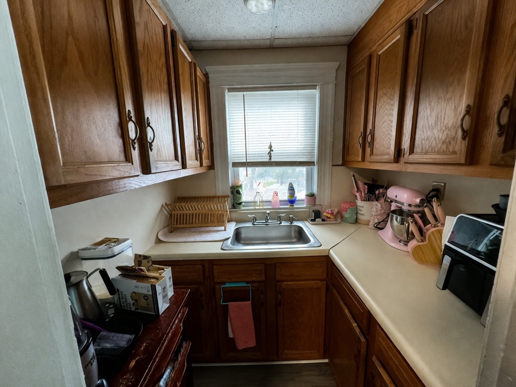 328 Brooks Street Worcester, MA 01606 - Photo 21 of 32 a kitchen with a sink appliances and cabinets