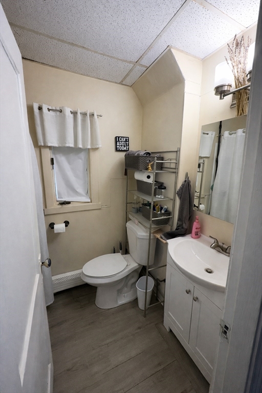 328 Brooks Street Worcester, MA 01606 - Photo 25 of 32 a bathroom with a toilet sink and mirror