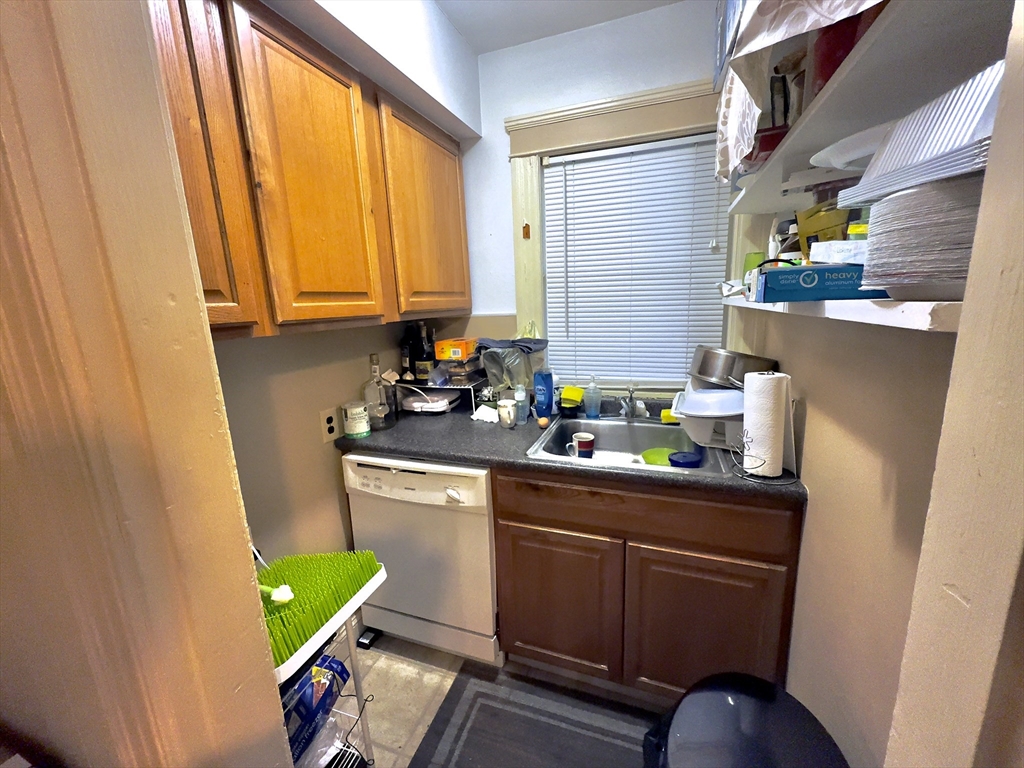 328 Brooks Street Worcester, MA 01606 - Photo 29 of 32 a view of a kitchen with a sink and cabinets