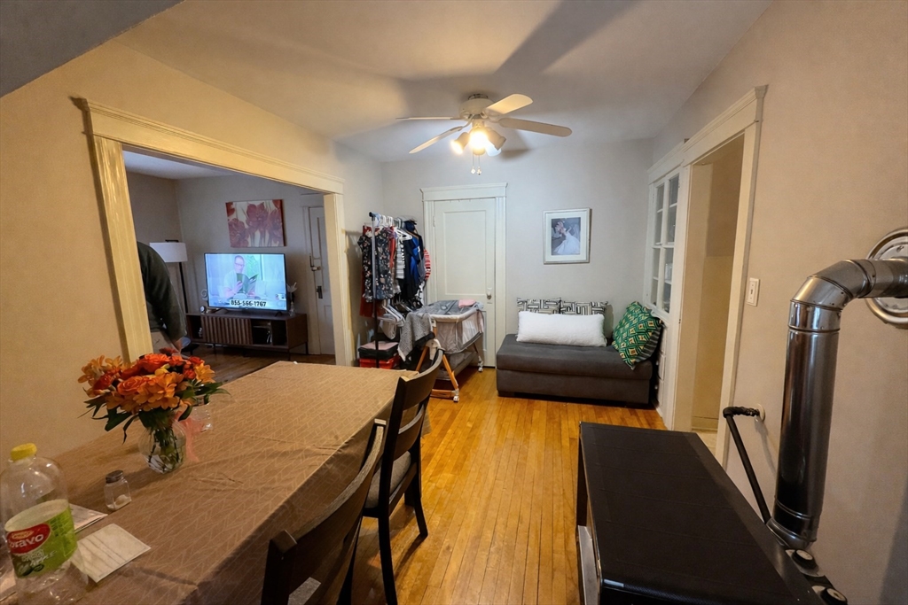 328 Brooks Street Worcester, MA 01606 - Photo 30 of 32 a view of a dining room with furniture and a flat screen tv