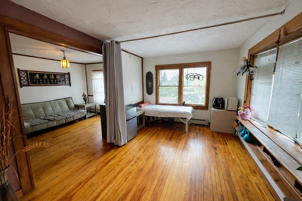 328 Brooks Street Worcester, MA 01606 - Photo 10 of 32 a living room with furniture and a wooden floor