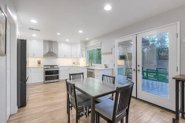 a kitchen with lots of counter top space and dining table