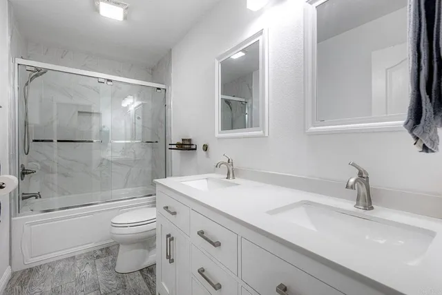 a bedroom with a bed couch and window