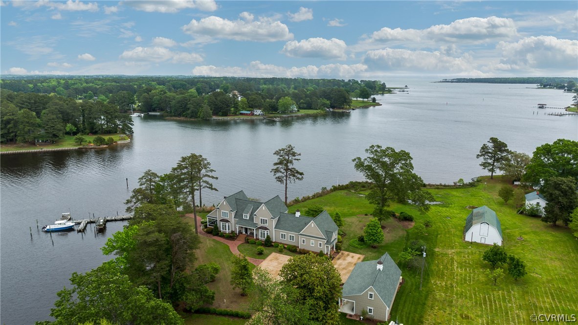 1571 Pine Hall Road Mathews, VA 23109 - Photo 1 of 48 an aerial view of lake residential house with outdoor space and trees around