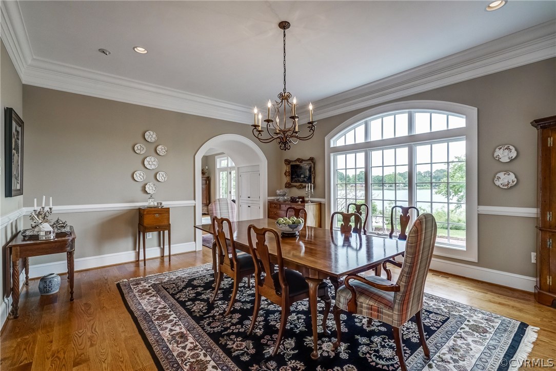 1571 Pine Hall Road Mathews, VA 23109 - Photo 12 of 48 a view of a dining room with furniture window and wooden floor