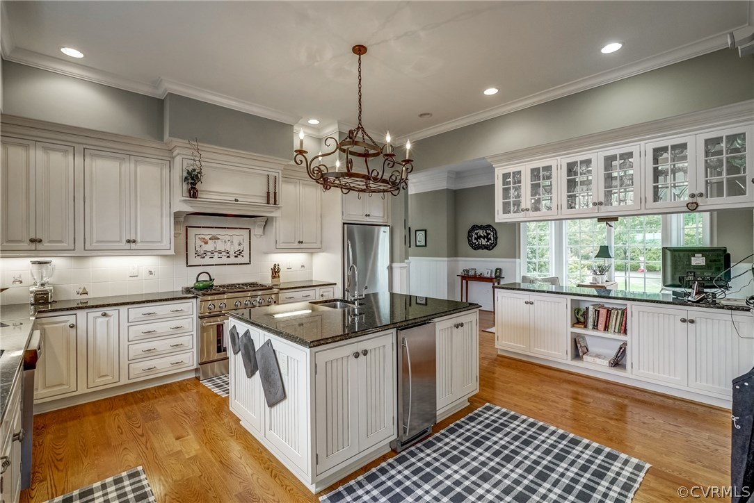 1571 Pine Hall Road Mathews, VA 23109 - Photo 16 of 48 a kitchen with stainless steel appliances granite countertop a stove a sink and a refrigerator