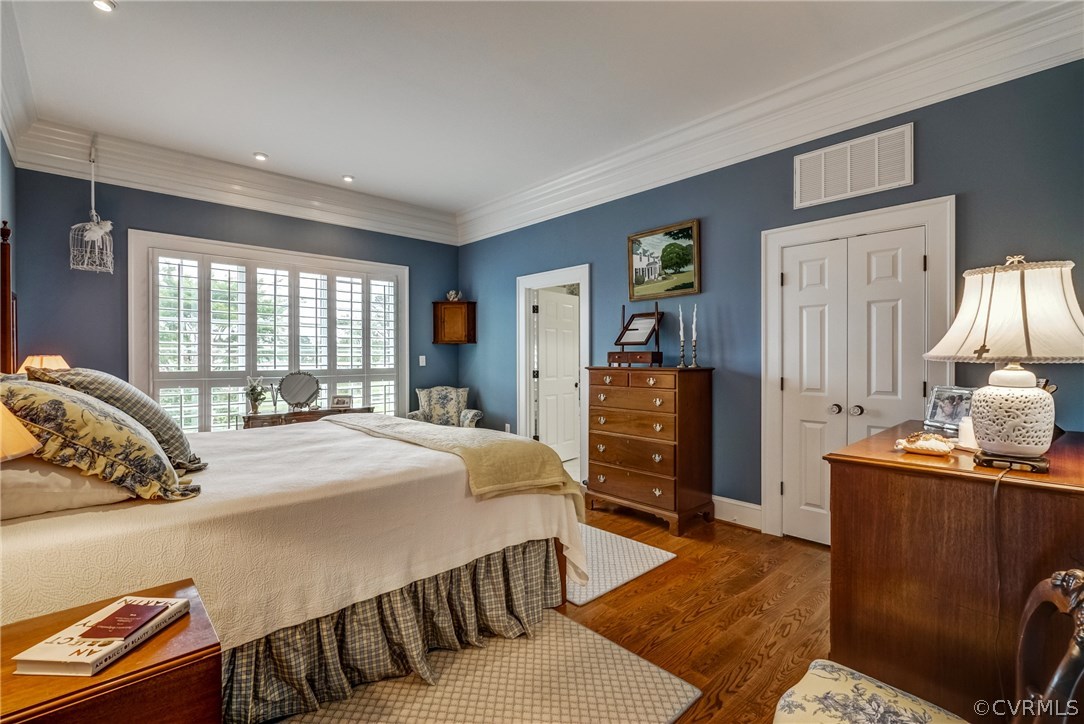 1571 Pine Hall Road Mathews, VA 23109 - Photo 20 of 48 a bedroom with a bed and wooden furniture