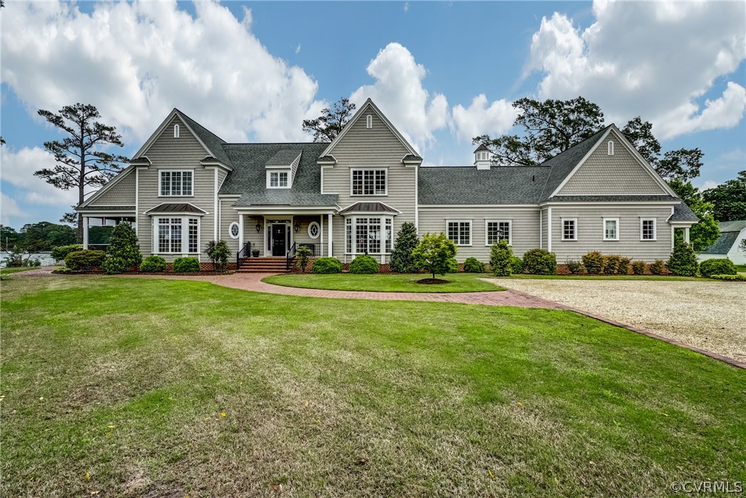 1571 Pine Hall Road Mathews, VA 23109 - Photo 2 of 48 a front view of a house with a yard