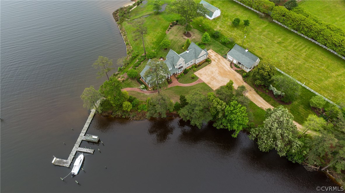 1571 Pine Hall Road Mathews, VA 23109 - Photo 3 of 48 an aerial view of a house with a yard and lake view