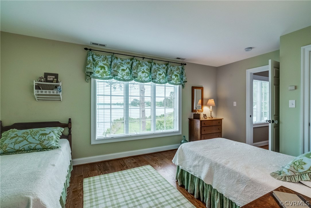 1571 Pine Hall Road Mathews, VA 23109 - Photo 33 of 48 a bedroom with a large bed and a window