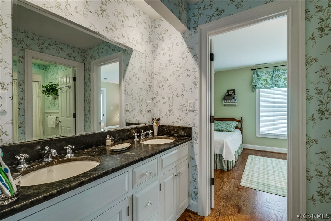 1571 Pine Hall Road Mathews, VA 23109 - Photo 34 of 48 a en suite bathroom with a granite countertop sink and a mirror