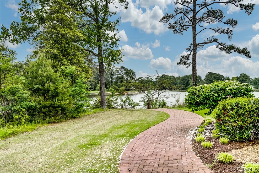 1571 Pine Hall Road Mathews, VA 23109 - Photo 36 of 48 a view of a yard with plants and a fountain