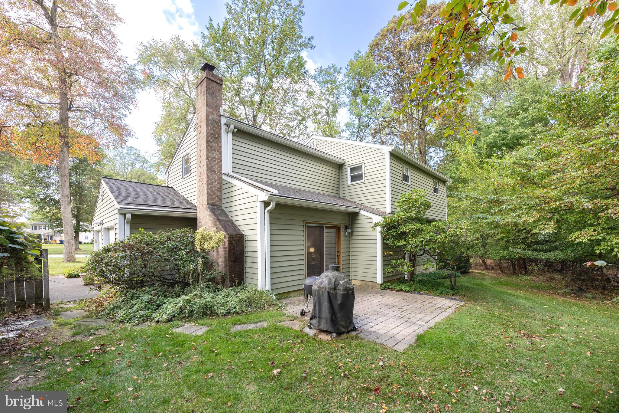208 Morris Road Exton, PA 19341 - Photo 29 of 43 a backyard of a house with plants and large tree
