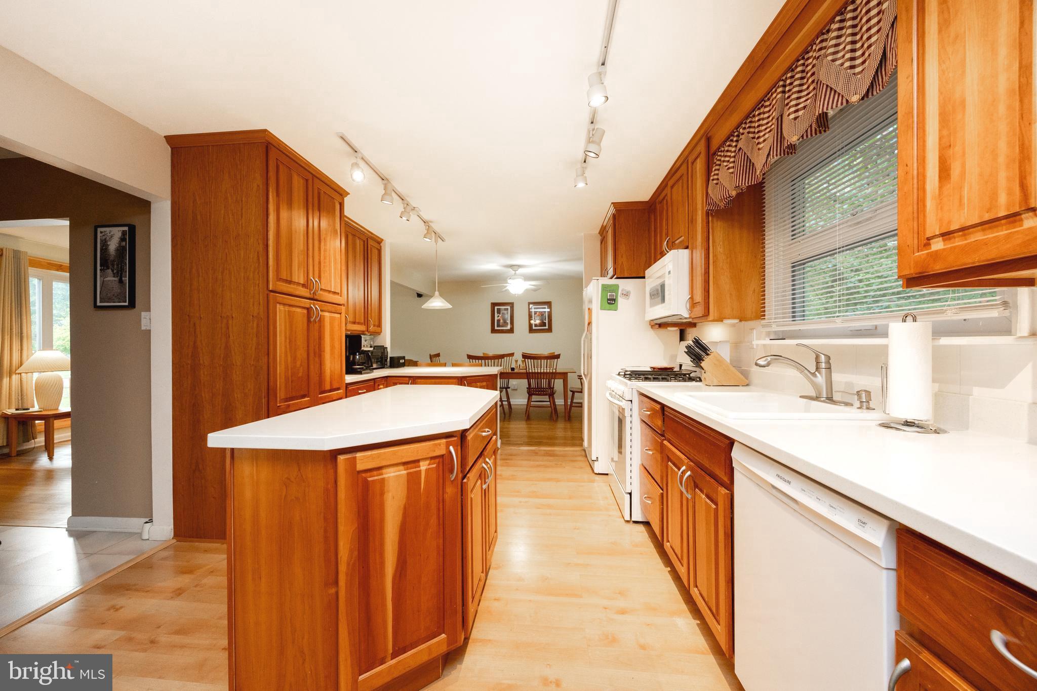 208 Morris Road Exton, PA 19341 - Photo 3 of 43 a kitchen with stainless steel appliances kitchen island a large counter top a stove and a sink