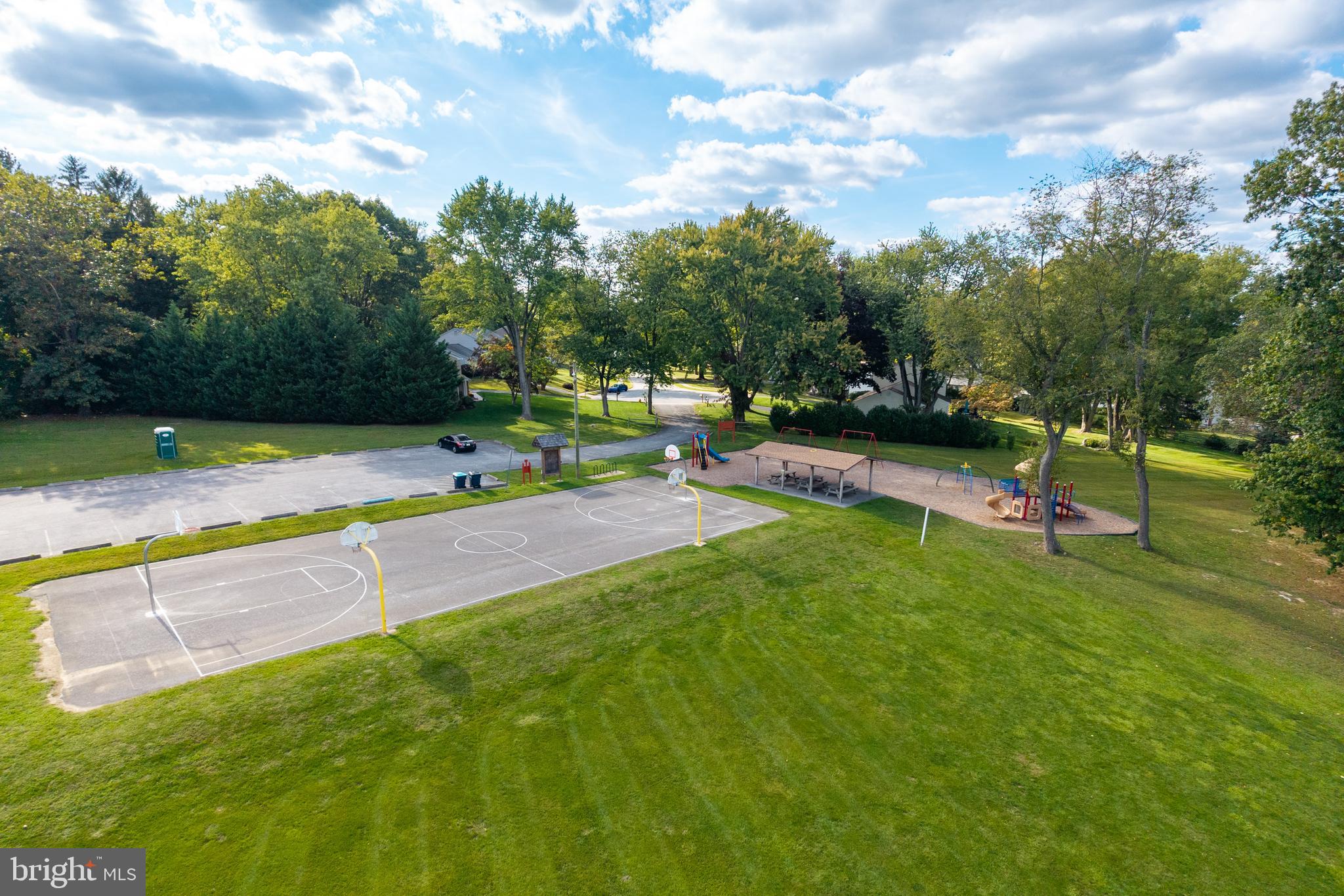 208 Morris Road Exton, PA 19341 - Photo 39 of 43 a view of a park with swings and slides
