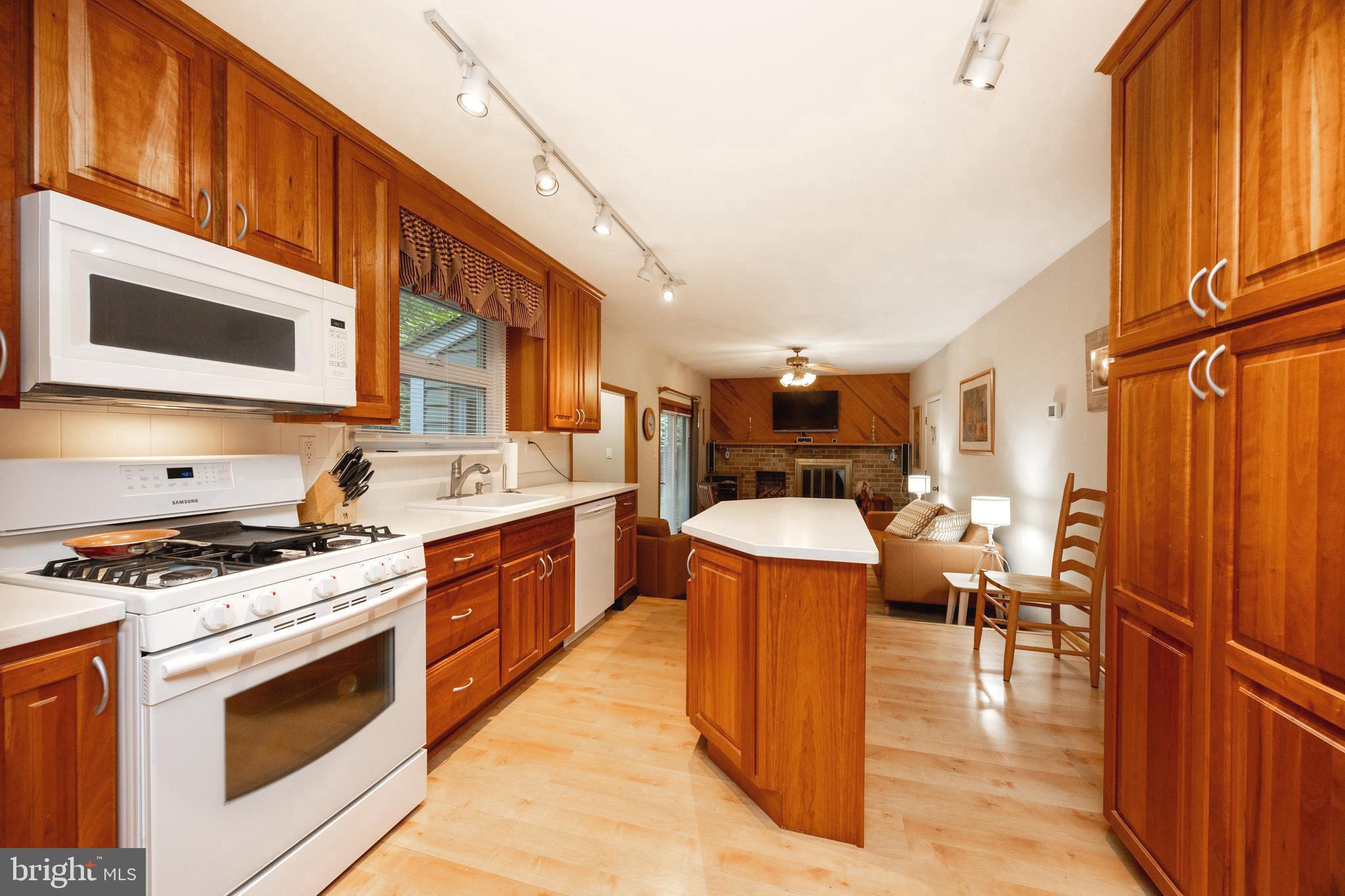 208 Morris Road Exton, PA 19341 - Photo 4 of 43 a kitchen with stainless steel appliances granite countertop a stove top oven a sink dishwasher and cabinets with wooden floor