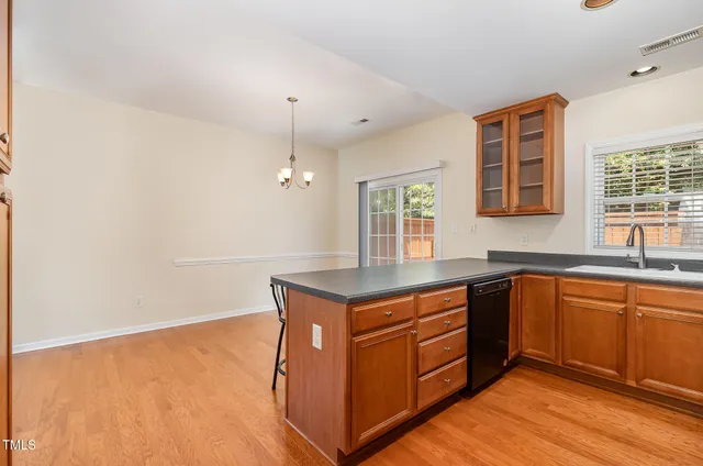 a kitchen with stainless steel appliances granite countertop a stove and a sink