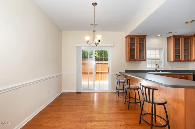 a room with dining table and a window