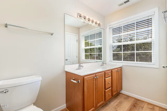 a kitchen with a sink and a toilet