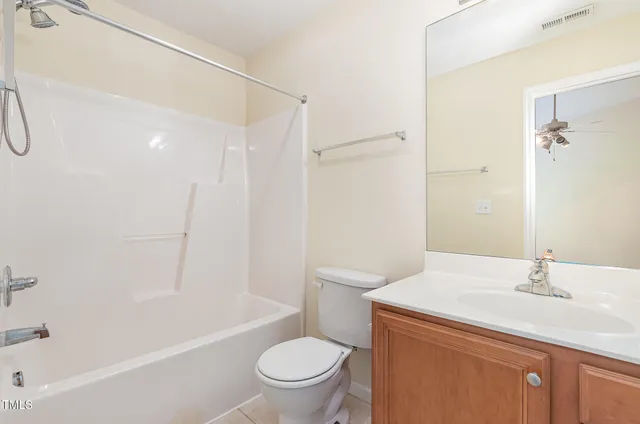 a bathroom with a sink a toilet and a bathtub