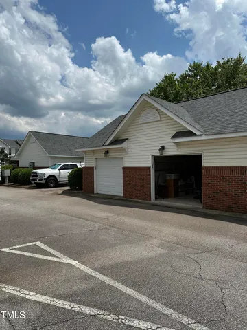 a view of a car parked in front of a house