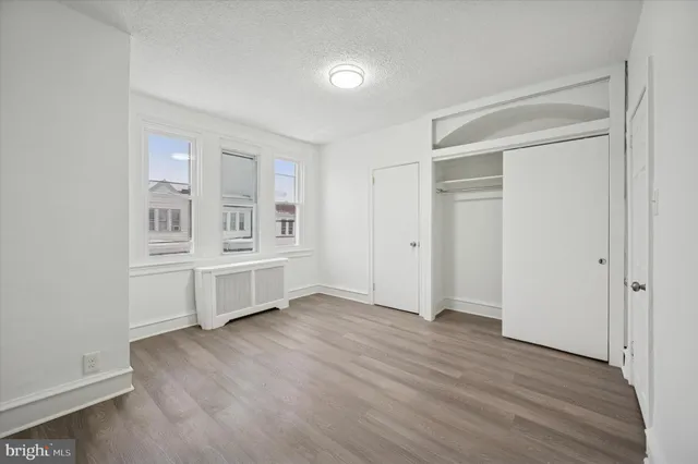 wooden floor and white walls