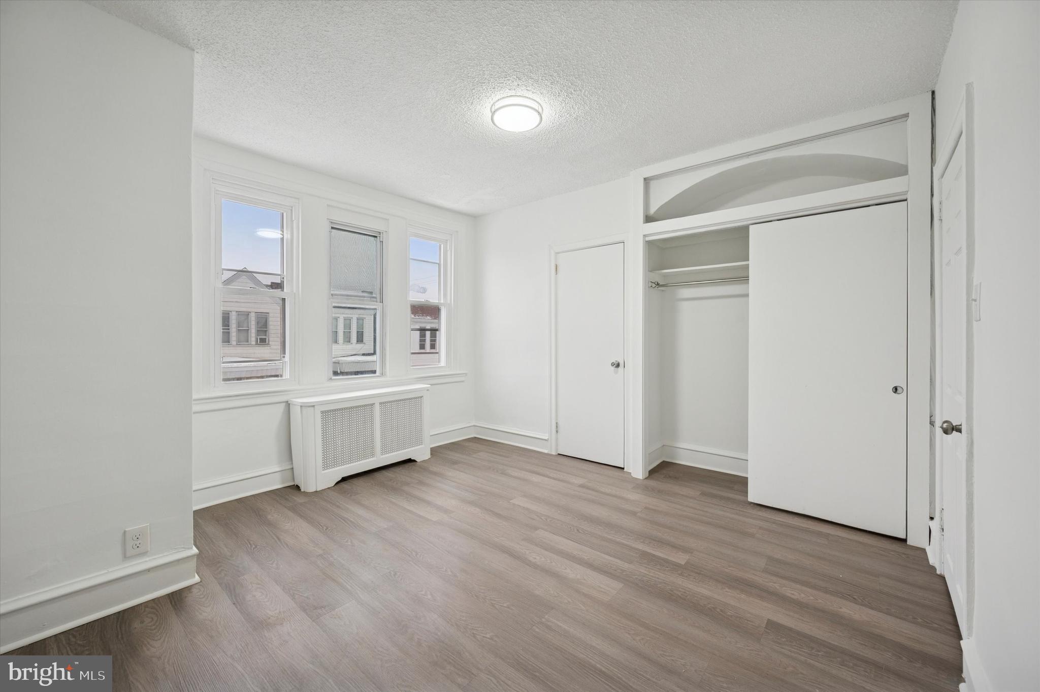 892 Granite Street Philadelphia, PA 19124 - Photo 12 of 15 wooden floor and white walls
