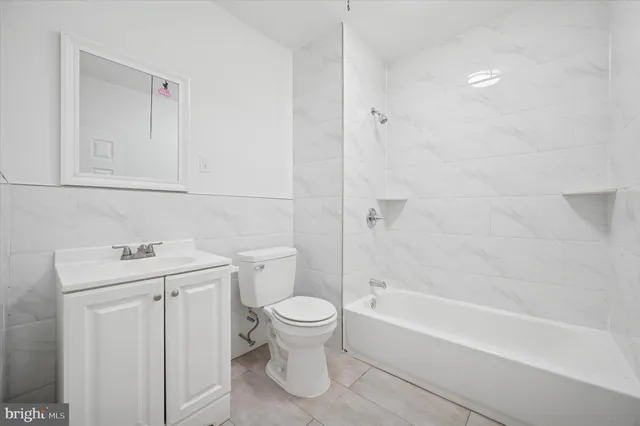 a bathroom with a sink a toilet and a bathtub