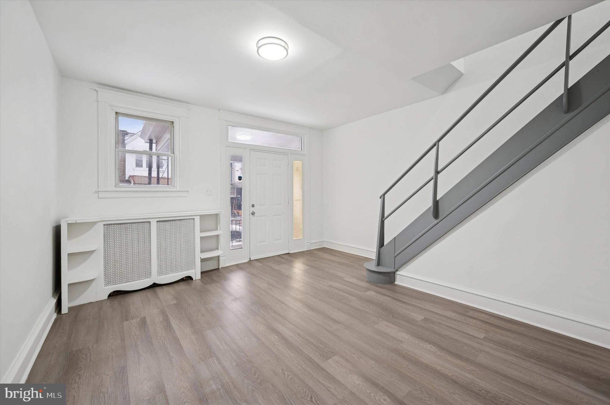 892 Granite Street Philadelphia, PA 19124 - Photo 3 of 15 wooden floor in an empty room with a window