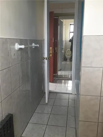 a bathroom with a glass shower door