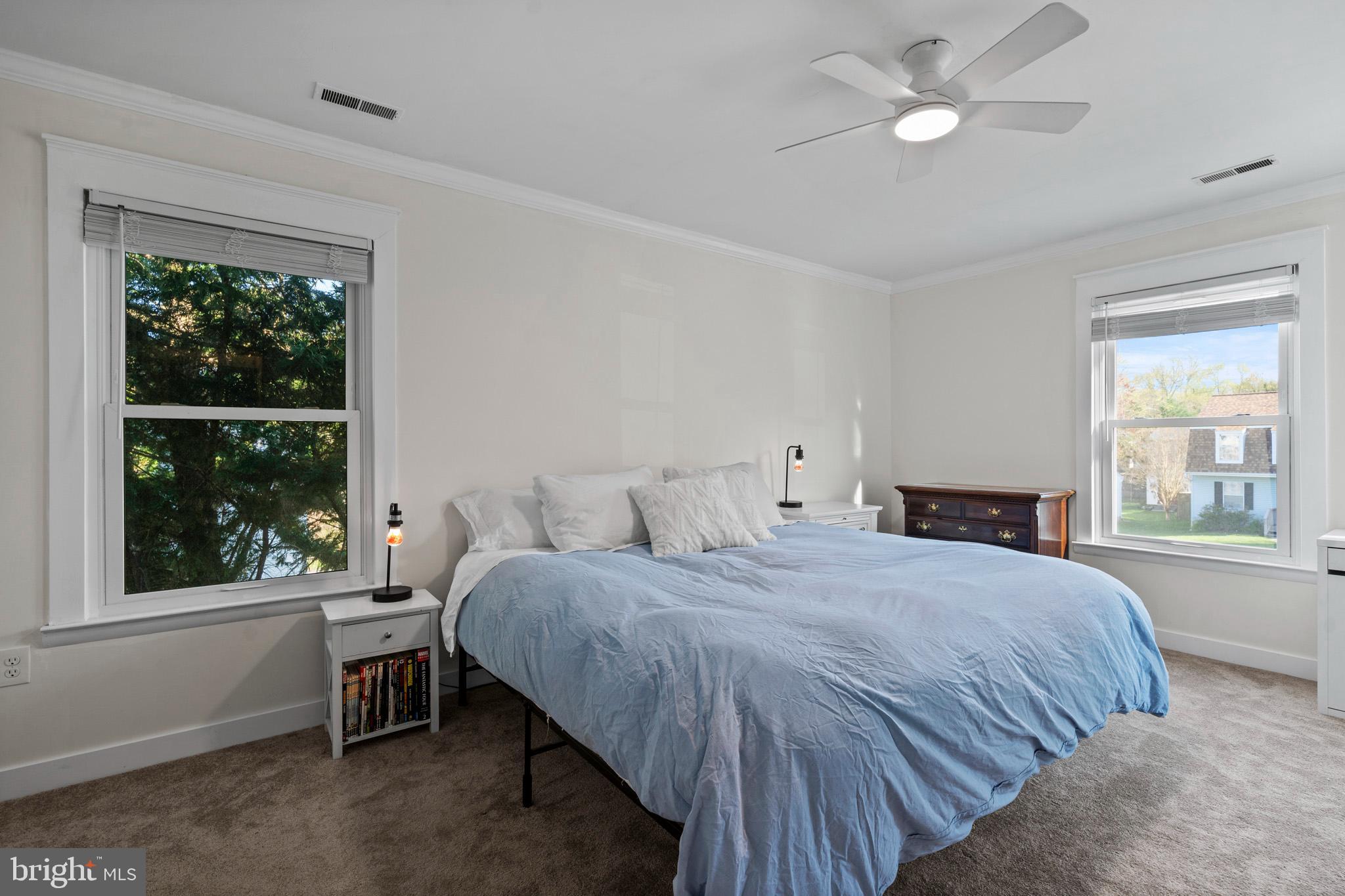 3704 9th Street North Beach, MD 20714 - Photo 18 of 42 a bedroom with a bed and a window