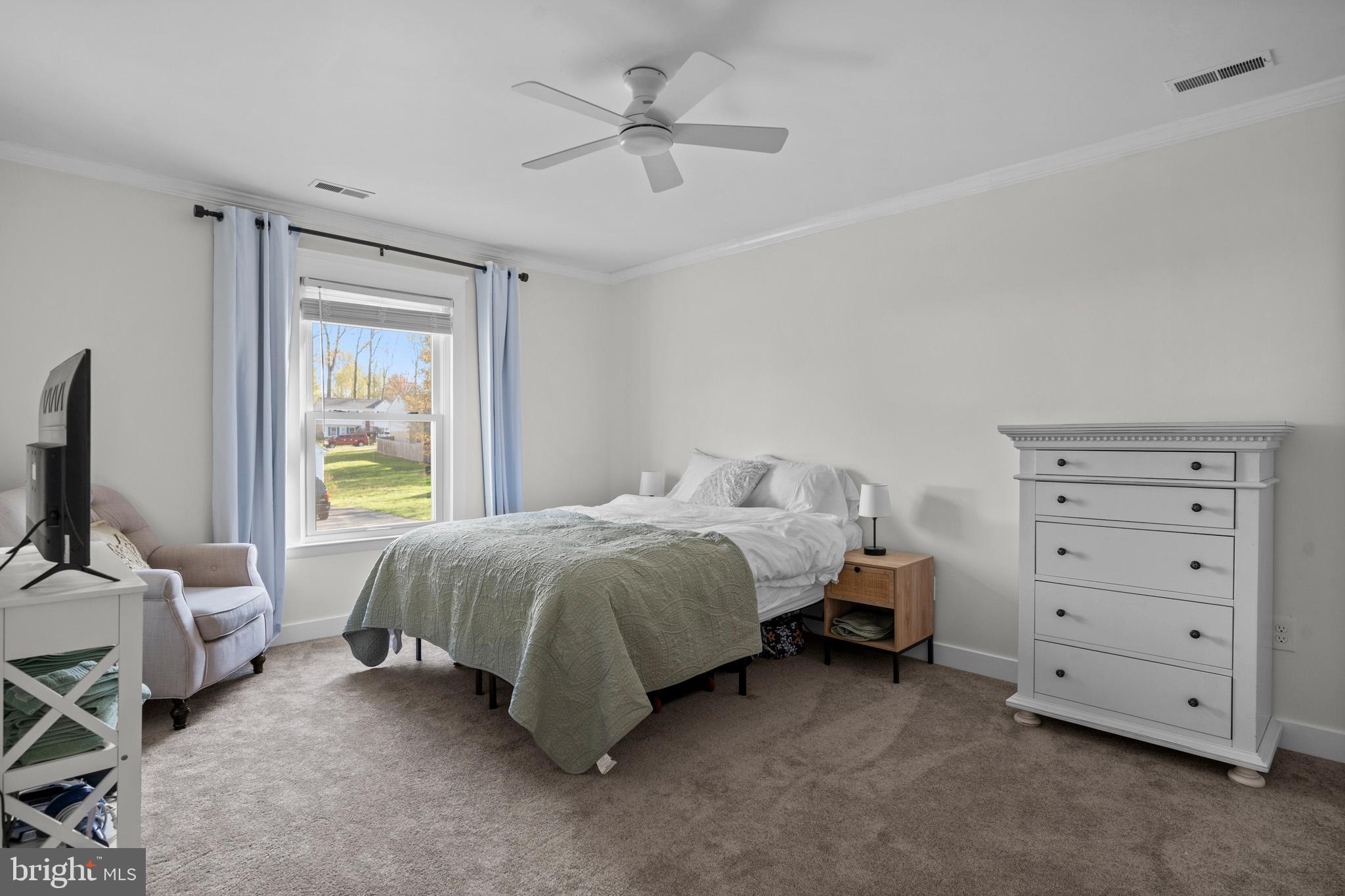 3704 9th Street North Beach, MD 20714 - Photo 22 of 42 a bed room with a bed and a television