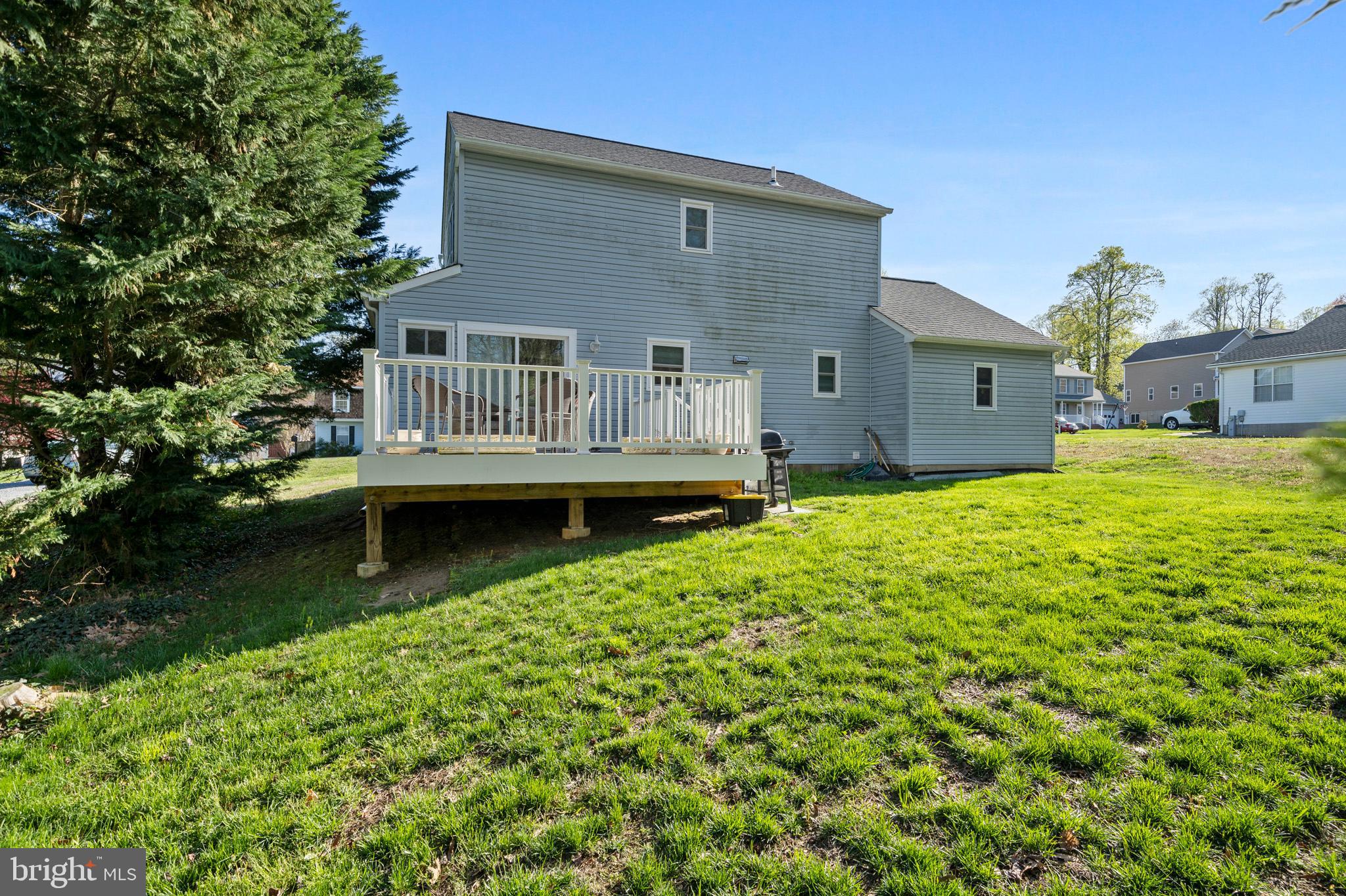 3704 9th Street North Beach, MD 20714 - Photo 28 of 42 a front view of a house with a garden and plants