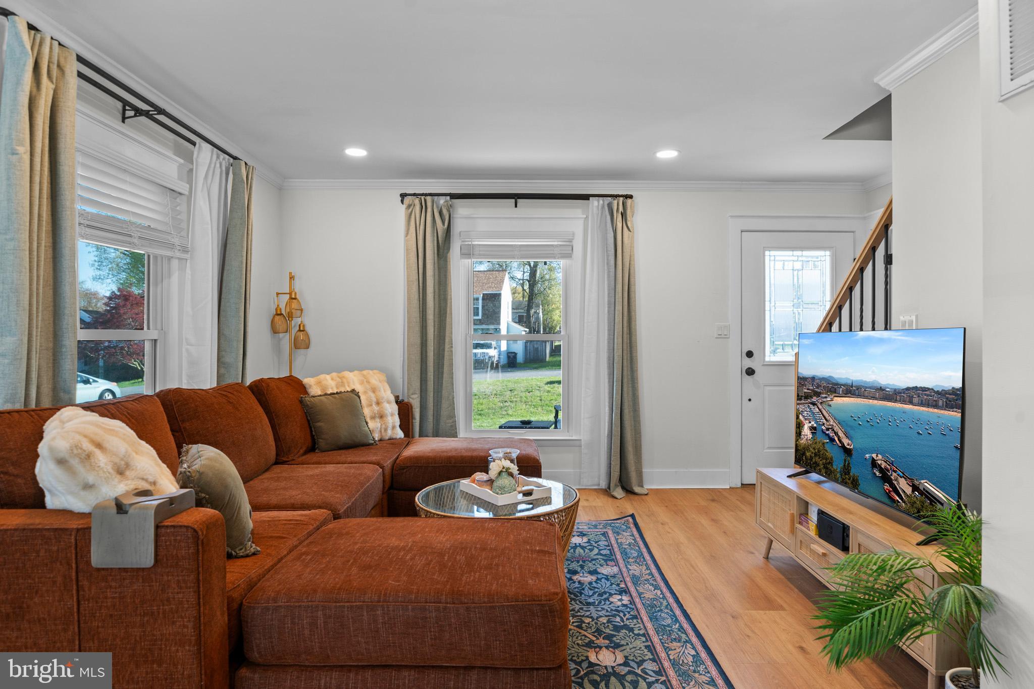 3704 9th Street North Beach, MD 20714 - Photo 3 of 42 a living room with furniture and a flat screen tv