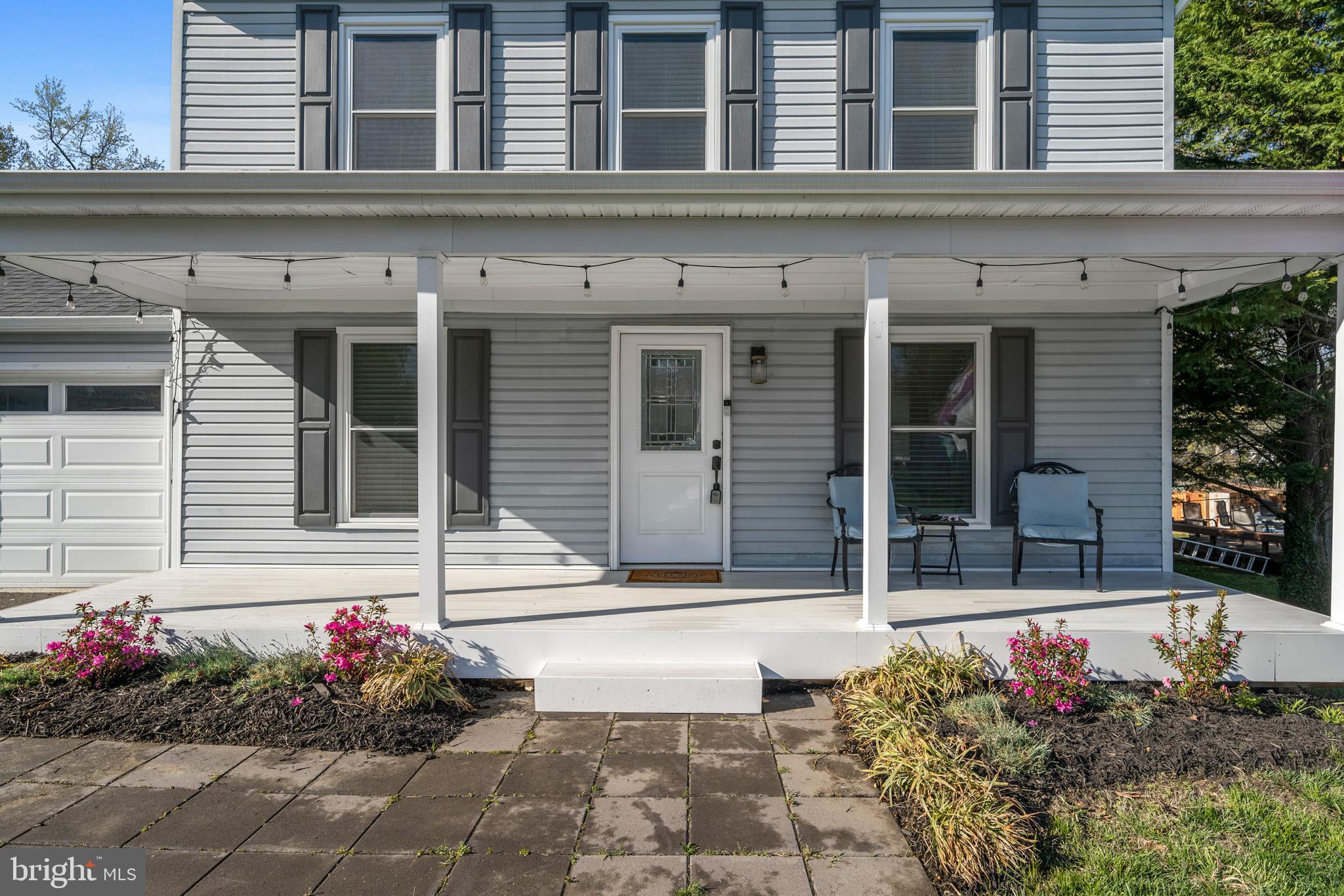 3704 9th Street North Beach, MD 20714 - Photo 32 of 42 a view of a building with flowers