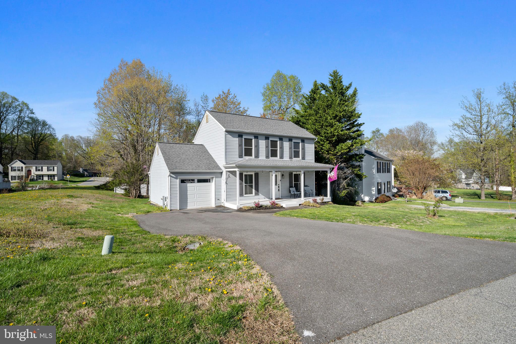 3704 9th Street North Beach, MD 20714 - Photo 33 of 42 a view of a big house with a big yard and large trees