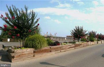 3704 9th Street North Beach, MD 20714 - Photo 39 of 42 a picture of a houses with a street