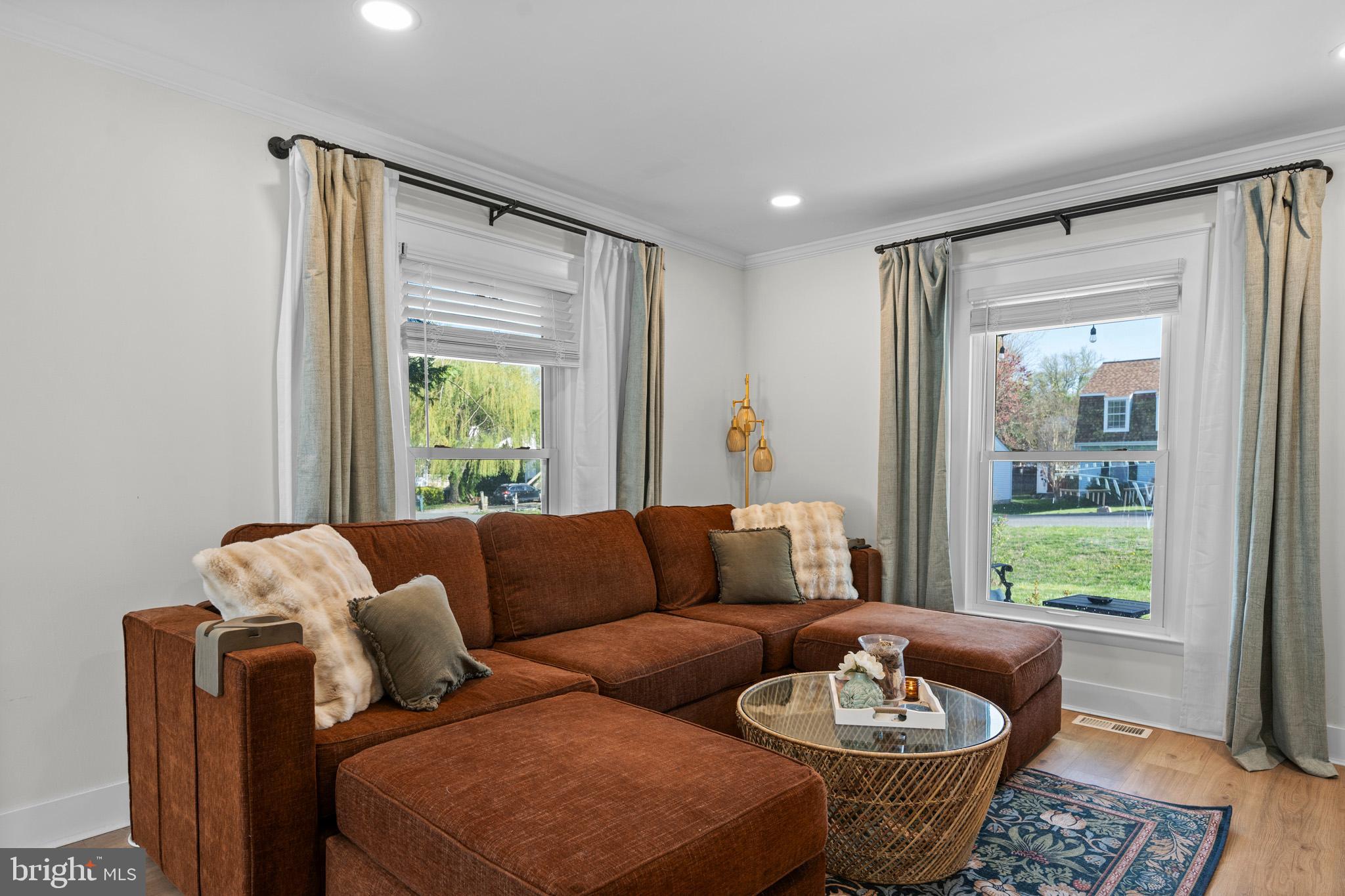 3704 9th Street North Beach, MD 20714 - Photo 4 of 42 a living room with furniture and a window