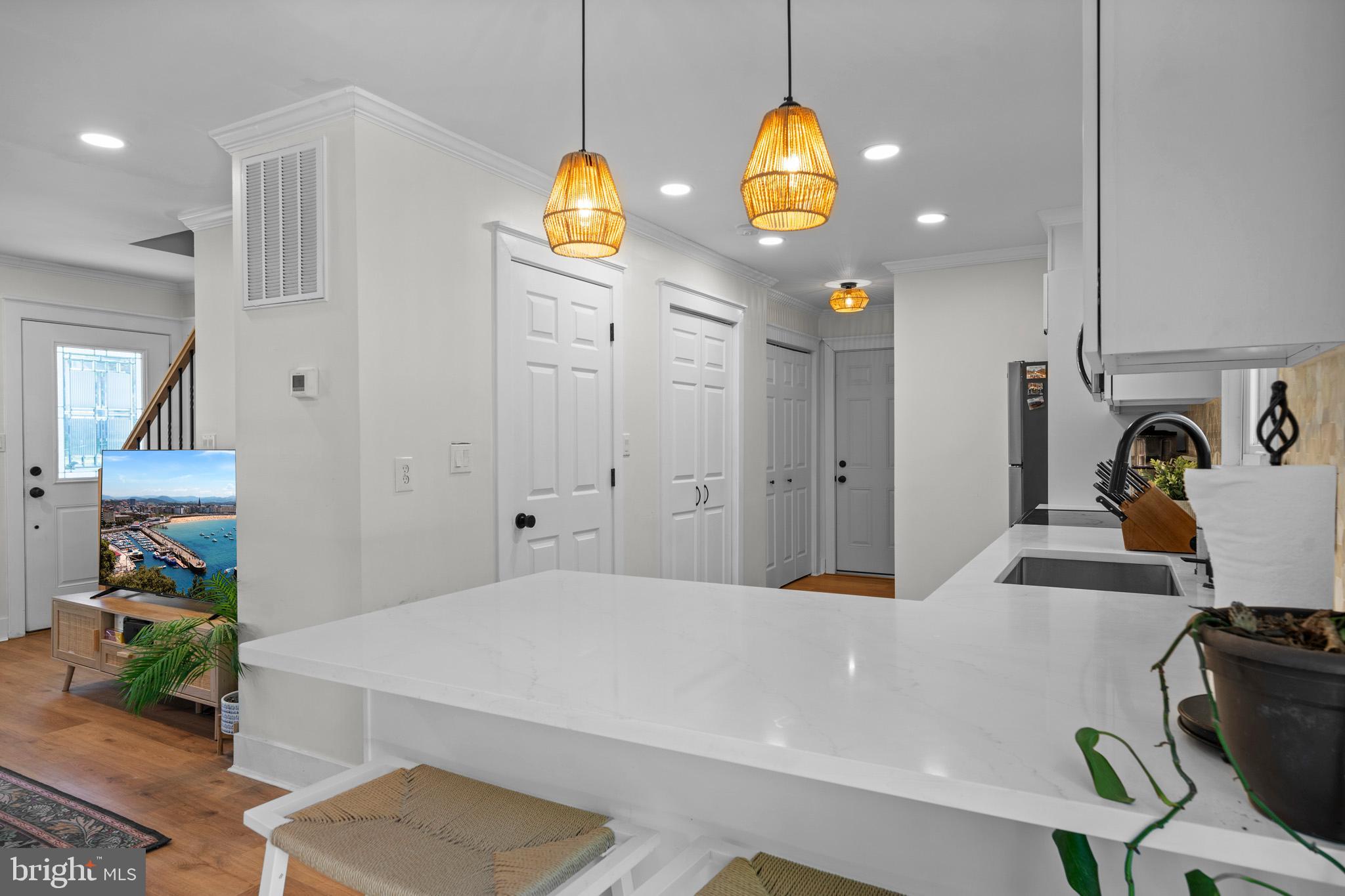 3704 9th Street North Beach, MD 20714 - Photo 9 of 42 a bathroom with a sink and a mirror
