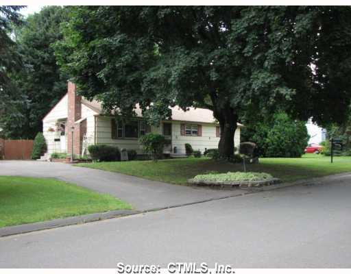 5 Redwing Road Enfield, CT 06082 - Photo 1 of 1 a front view of a house with a yard and a garage