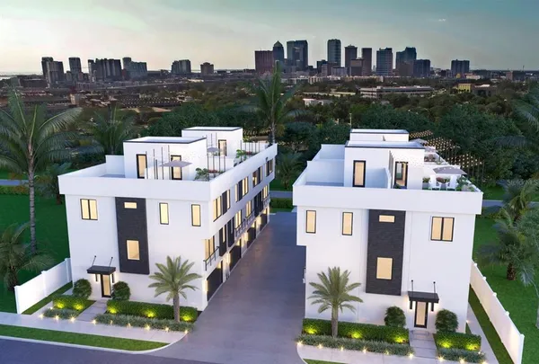 a aerial view of a house with a yard