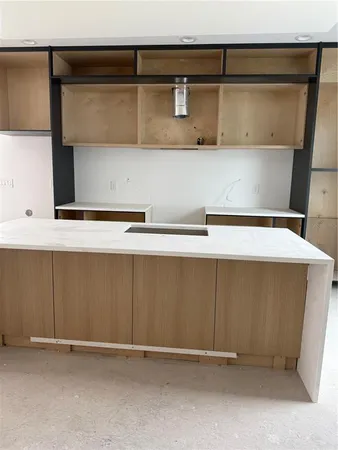 a kitchen with stainless steel appliances a stove and cabinets
