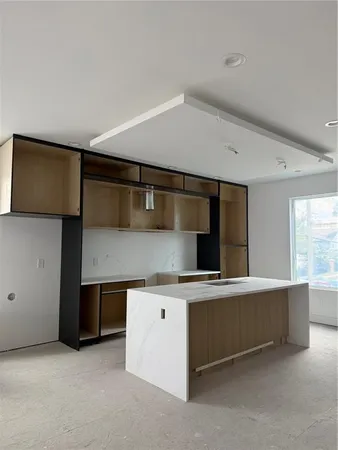 a utility room with two washing machine